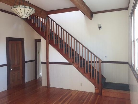 Living room and stairs to top floor