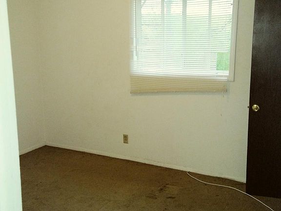 Bedroom 1 has a second floor view out the front of the unit and a deep closet.