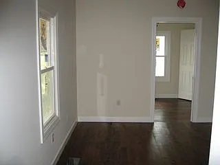 Living room from the doorway looking toward bedroom #3