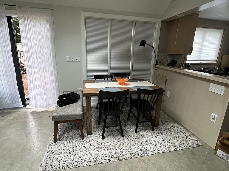 Dining area, triple windows & outswinging French doors.