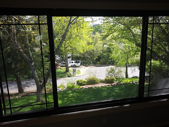 A view from the living room to the front yard. Just down the way is the path to North Clackamas Park.