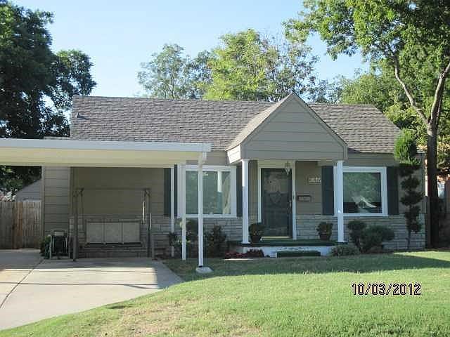 Exterior Front. 2 CAR GARAGE PLUS 2 CAR CARPORT