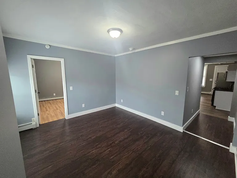 Dining Room / Living Room View of Kitchen and 3rd Bedroom
