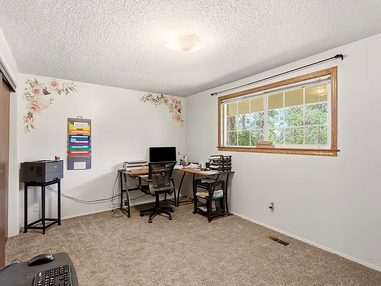 2nd upstairs bedroom has a large window and also works well as office