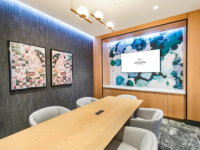 Host a meeting or brainstorm in the conference-style private coworking space, complete with sleek seating, modern tech, and vibrant design.