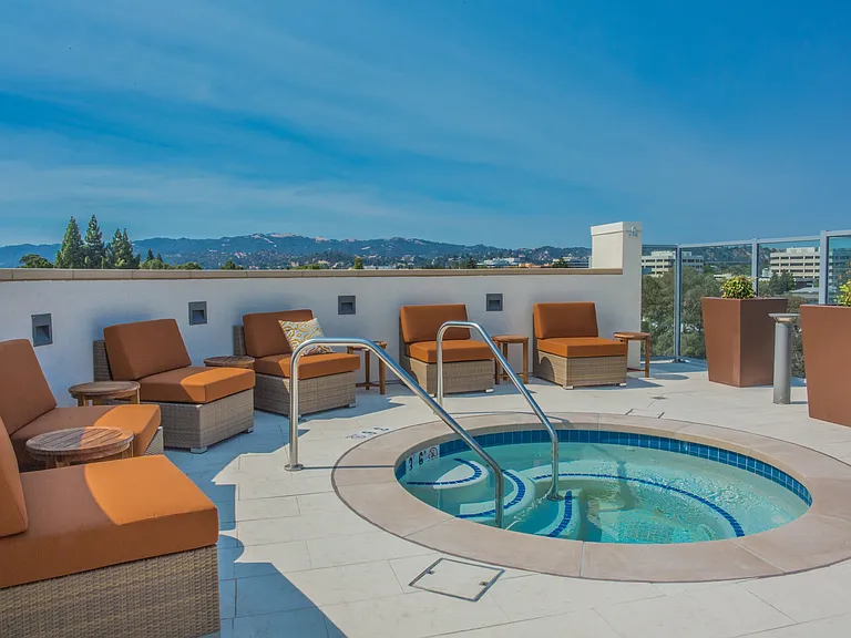 Soak up the sunshine in our dramatic, resort-inspired pool & spa with lounge cabanas.