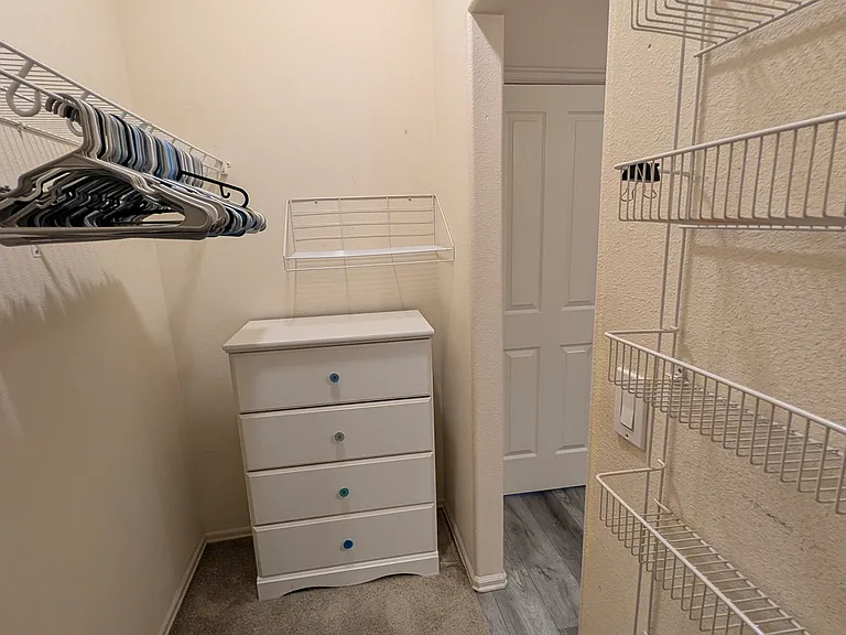 Master bath walk-in closet with lots of storage
