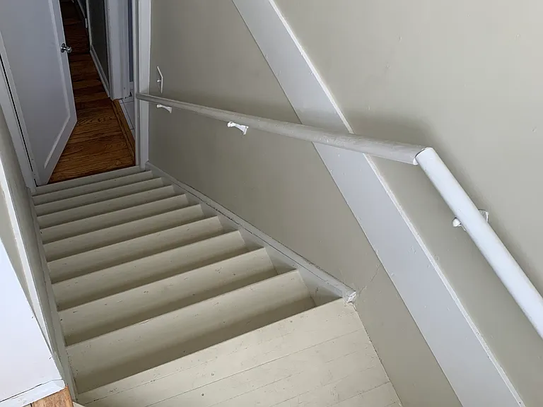 Stairs leading to third bedroom upstairs.