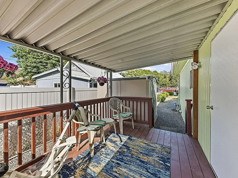 Back Patio. Walk way to carport.
8x8 storage shed can be seen. Shed great for yard tools.