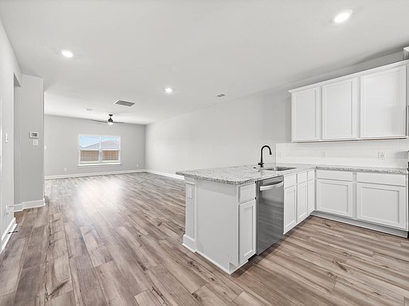 The kitchen of the Driftwood has a beautiful front yard view.