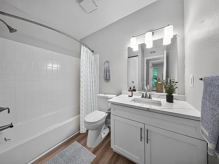 Elevate your daily routine in this stylish bathroom at The Woods at Ambler, an Eagle Rock Community. Enjoy modern finishes and ample space for relaxation. Make your move today and embrace a new standard of living!