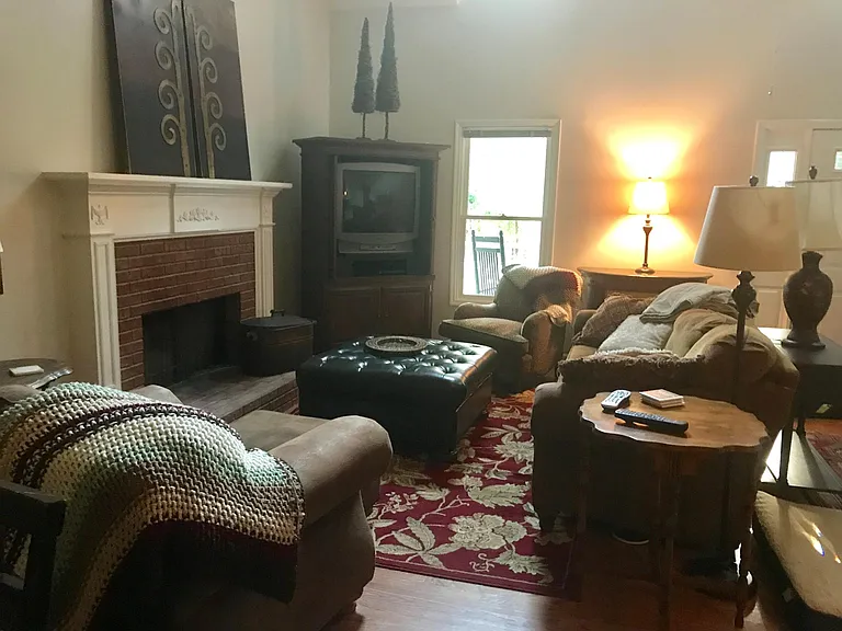 Great room has fireplace with gas logs