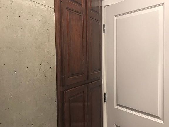 10 foot custom shoe closet with adjustable shelves. This solid wood space can have multi-functional use.