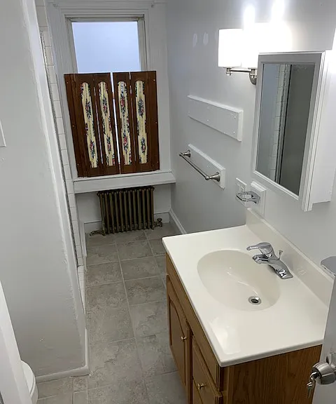 Bathroom 2. Shutters can be taken down or replaced.