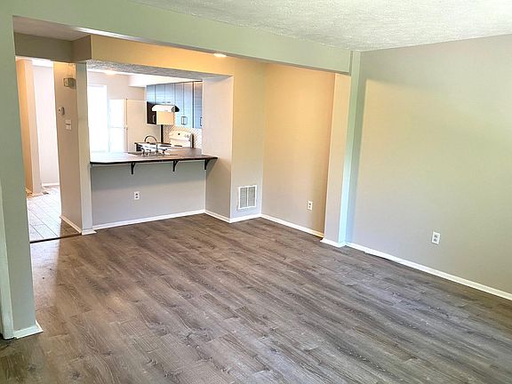 Main living area with overhand countertop breakfast space