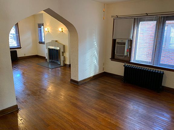 Dining room with window A/C and ceiling fan.