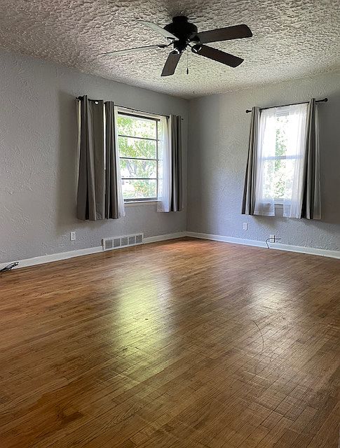 Light and bright living room with beautiful hardwood floors.