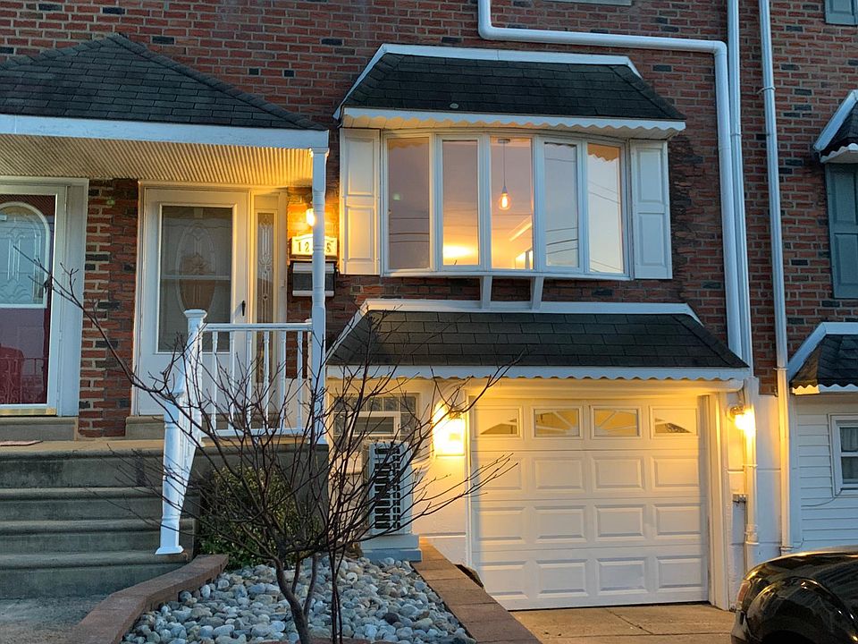 Beautiful brick work complemented with a rock garden and a dogwood tree recently planted. lights work on sensors