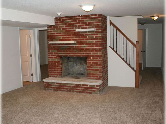 Lower level familyroom with brick fireplace