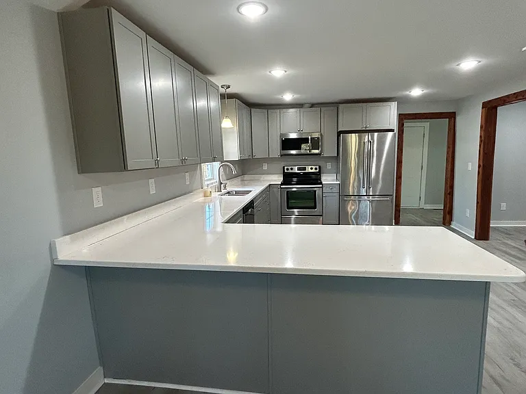 New Cabinets/Quartz countertops/LVP Flooring throughout the home. Open concept floor plan.