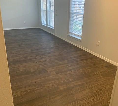DINNING ROOM VIEW INTO LIVING ROOM & FRONT DOOR