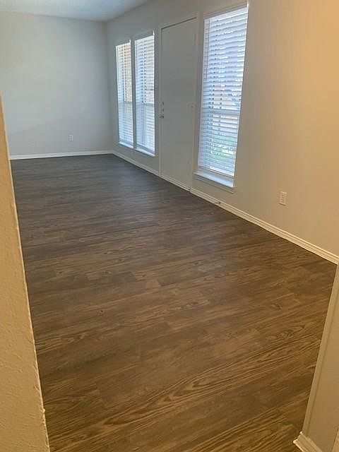 DINNING ROOM VIEW INTO LIVING ROOM & FRONT DOOR