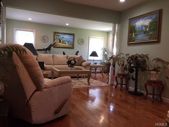 Large family room with door out to side of yard and full bath