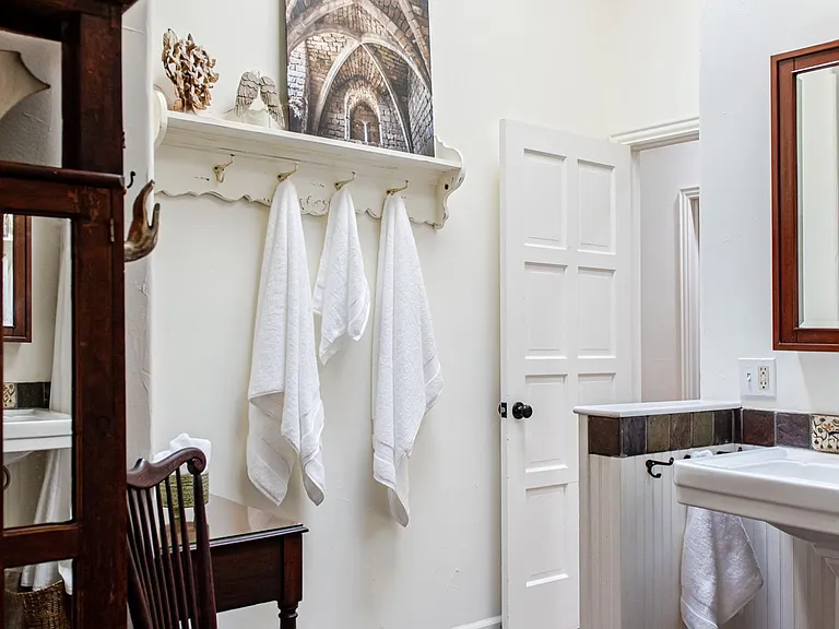 Two Pedestal Sinks and Bathtub