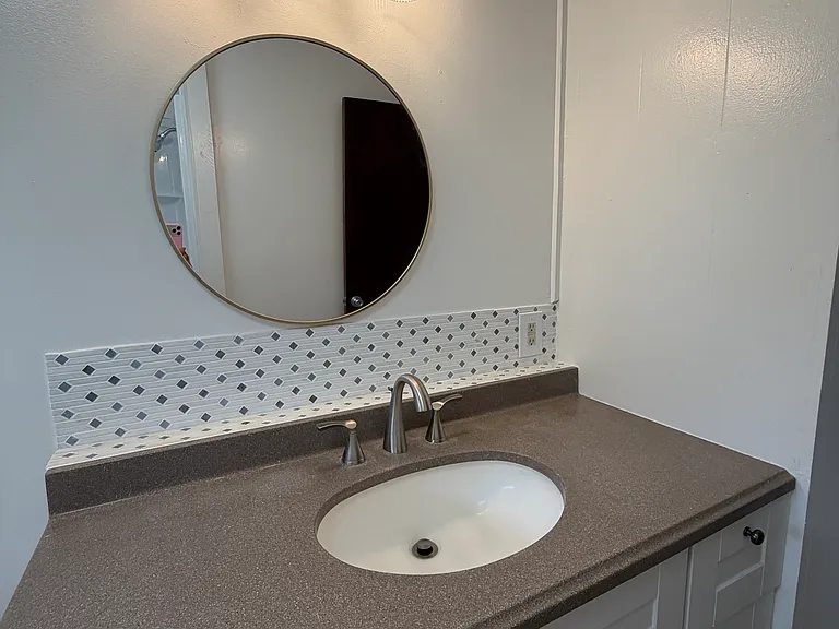 Remodeled bathroom sink and cabinets