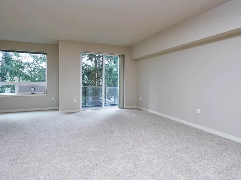 Carpeted Living Room with Juliet Balcony