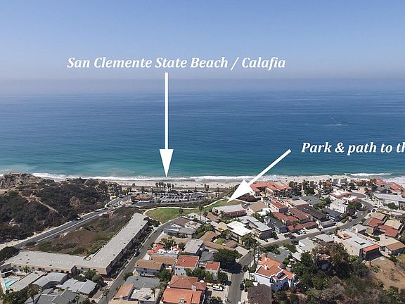 Approximately 150 yards from the beach and trails. The building is located on "The Loop" and it is has the two white roofs below the right arrow. Short cut to beach is just 3 doors down.