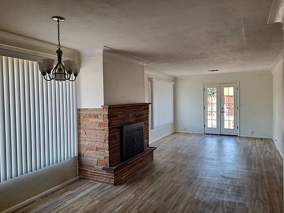 Livingroomm fireplace, and french doors to backyard