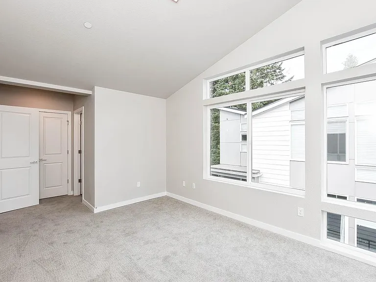 Guest bedroom with huge windows for extra natural light