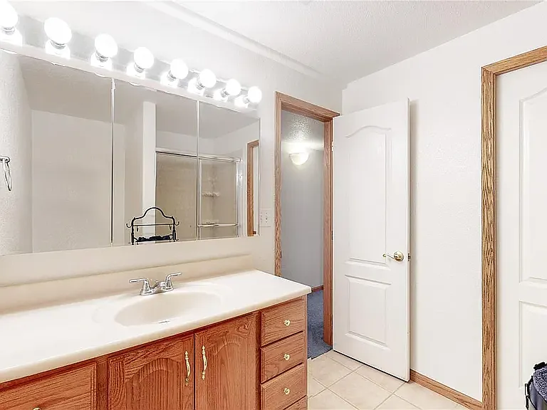 Basement bathroom with shower- entrance through hallway and bedroom.