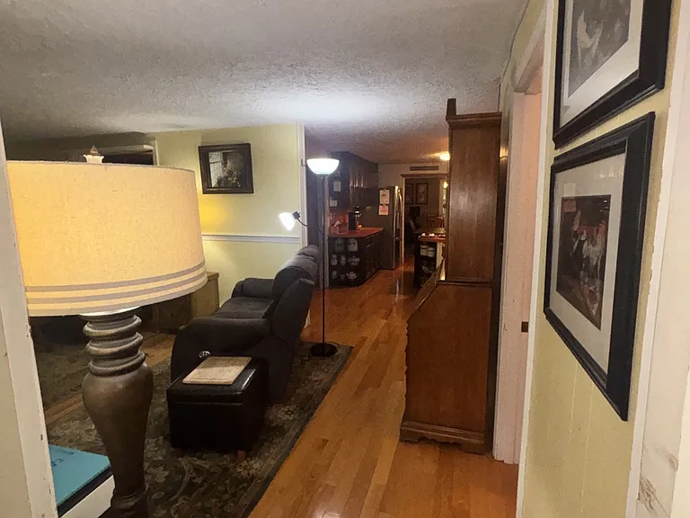 Leaving the sun room you will walk towards the kitchen, 1/2 bath with laundry. living room and Den.