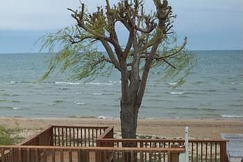 Your own private sugar sand beach with large deck and boathouse.