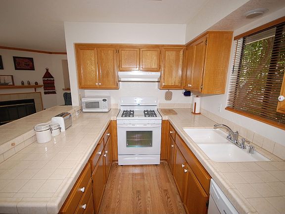 Kitchen with gas range and microwave