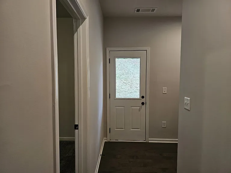 Door to Bedroom #1 + Door to Backyard