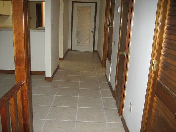 hall leading to kitchen and master bedroom