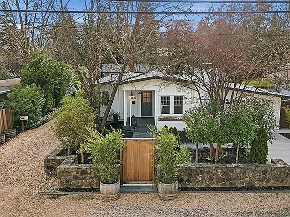 Front Privacy Gate with Olive trees bordering entry