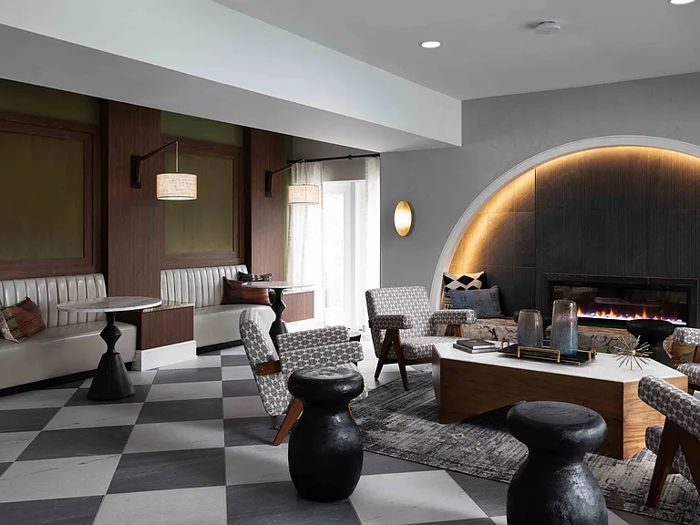 Resident lounge with fireplace and modern decor