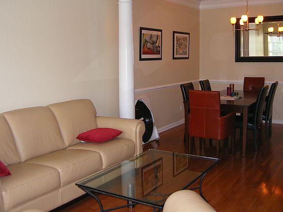 Living room leads into formal dining room