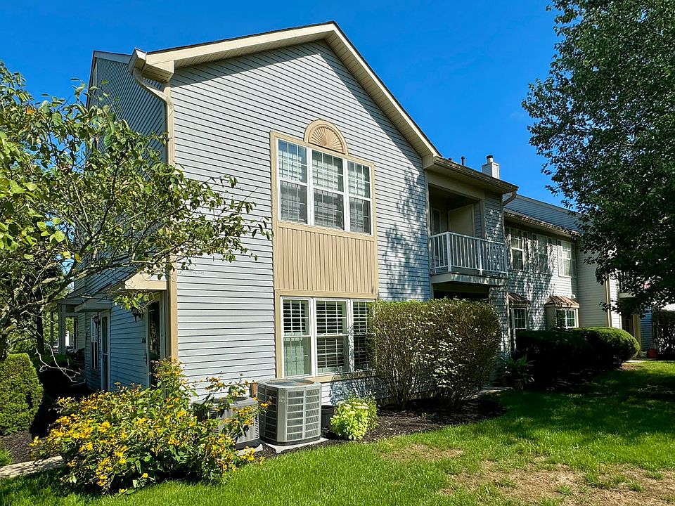 Outdoor area with balcony and grassy area