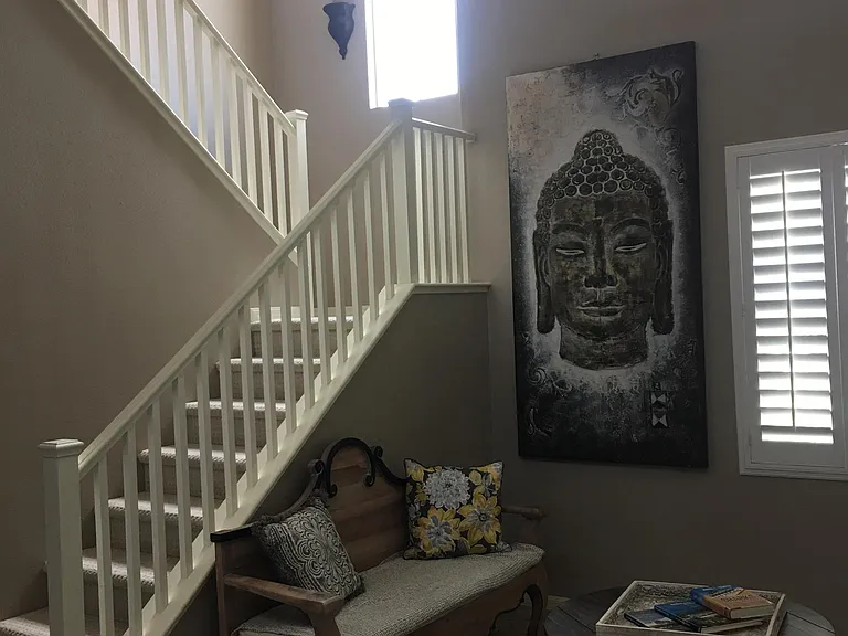 From the dining room, you'll have a clear view of the staircase leading up to the third level loft -