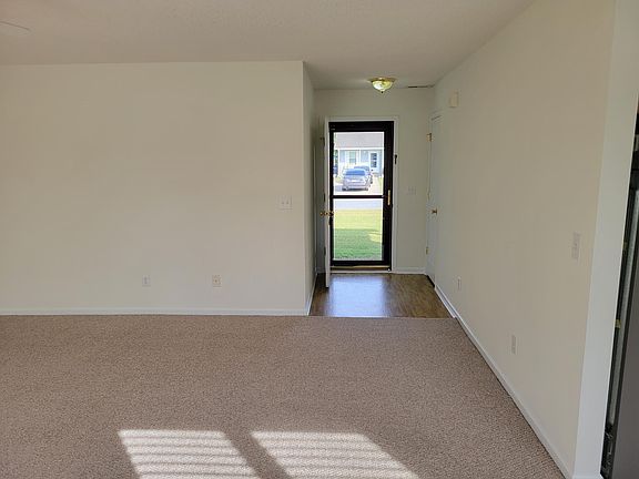 Living Room looking from sliding door to front door