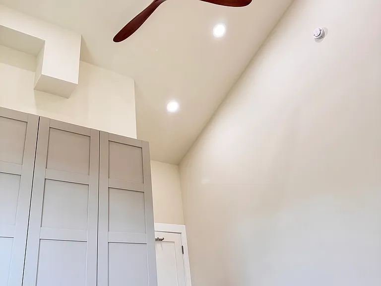 Bedroom 1 - High Ceiling with recessed lights and fan