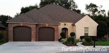 Front of Home : Arched 2 Car Garage, Brick and brick buttercoat, Hardi siding, fascia, soffits