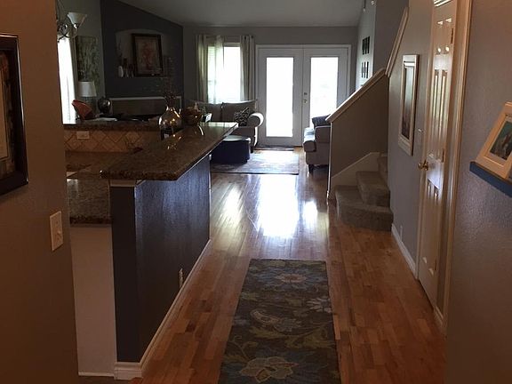 View from front door looking at kitchen and living room