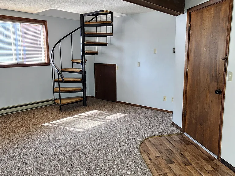 Door leads to laundry room and exit of building