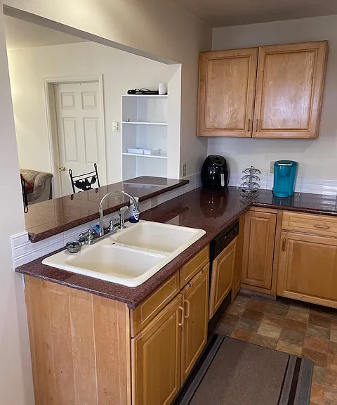 While working at the sink, you are facing the living area.